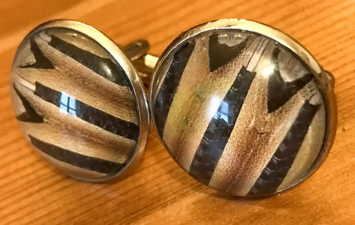 Cufflinks, featuring accordion bellows