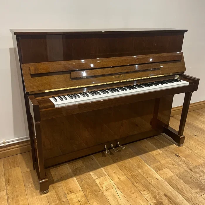 Pre-owned Yamaha E116 upright piano in polished walnut, c.1996